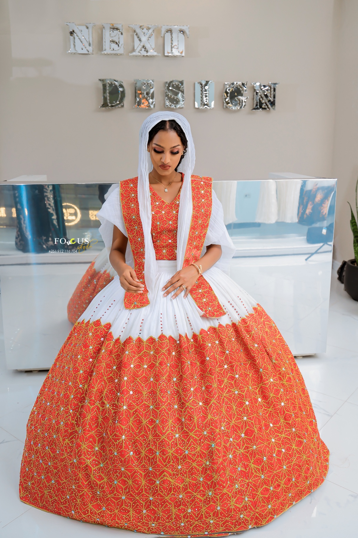 An ivory occasion-wear dress from Next Fashion Design